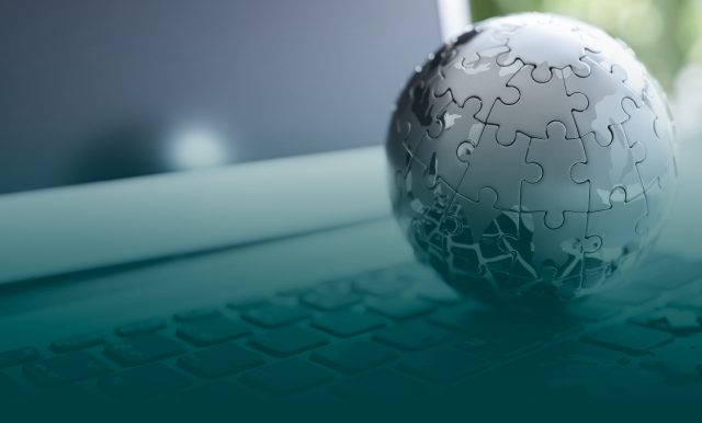 on the image puzzle globe on open laptop
